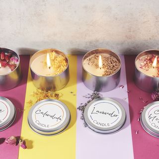 Tin candles with dried flowers