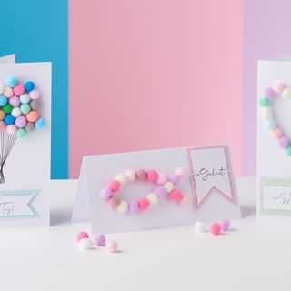 Cards with colourful pompoms